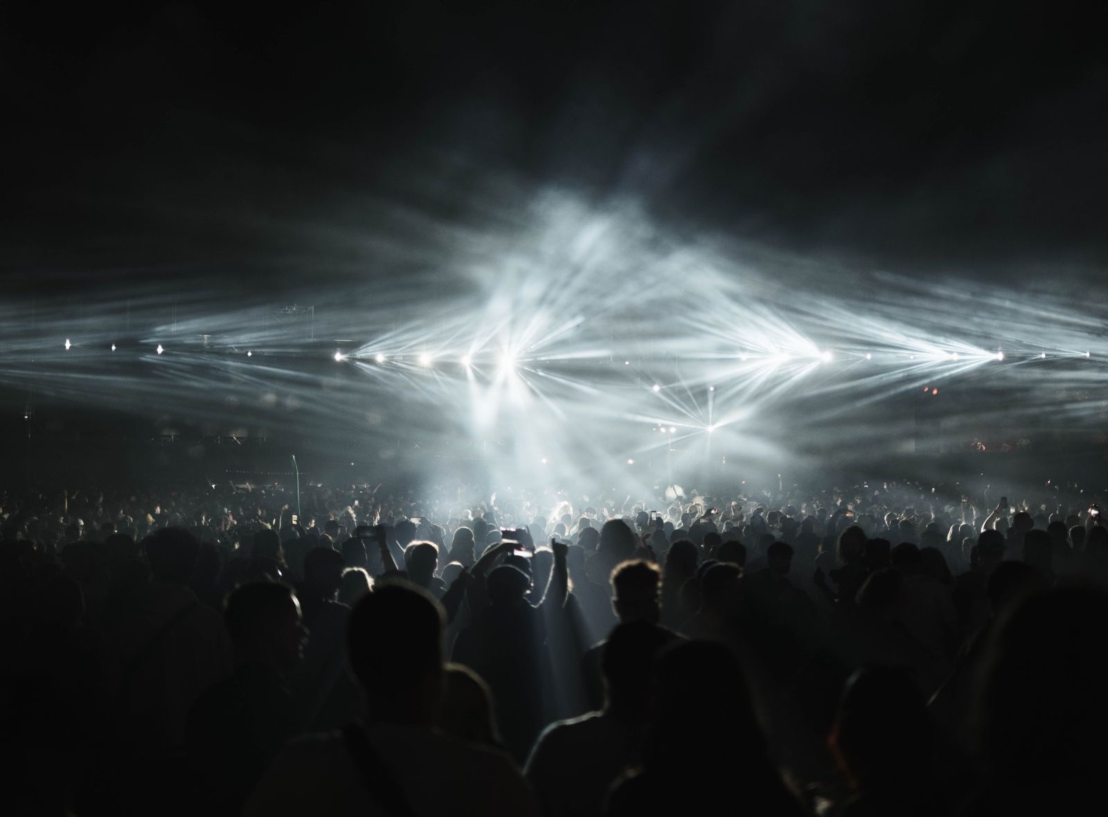 Festival crowd under stage lights